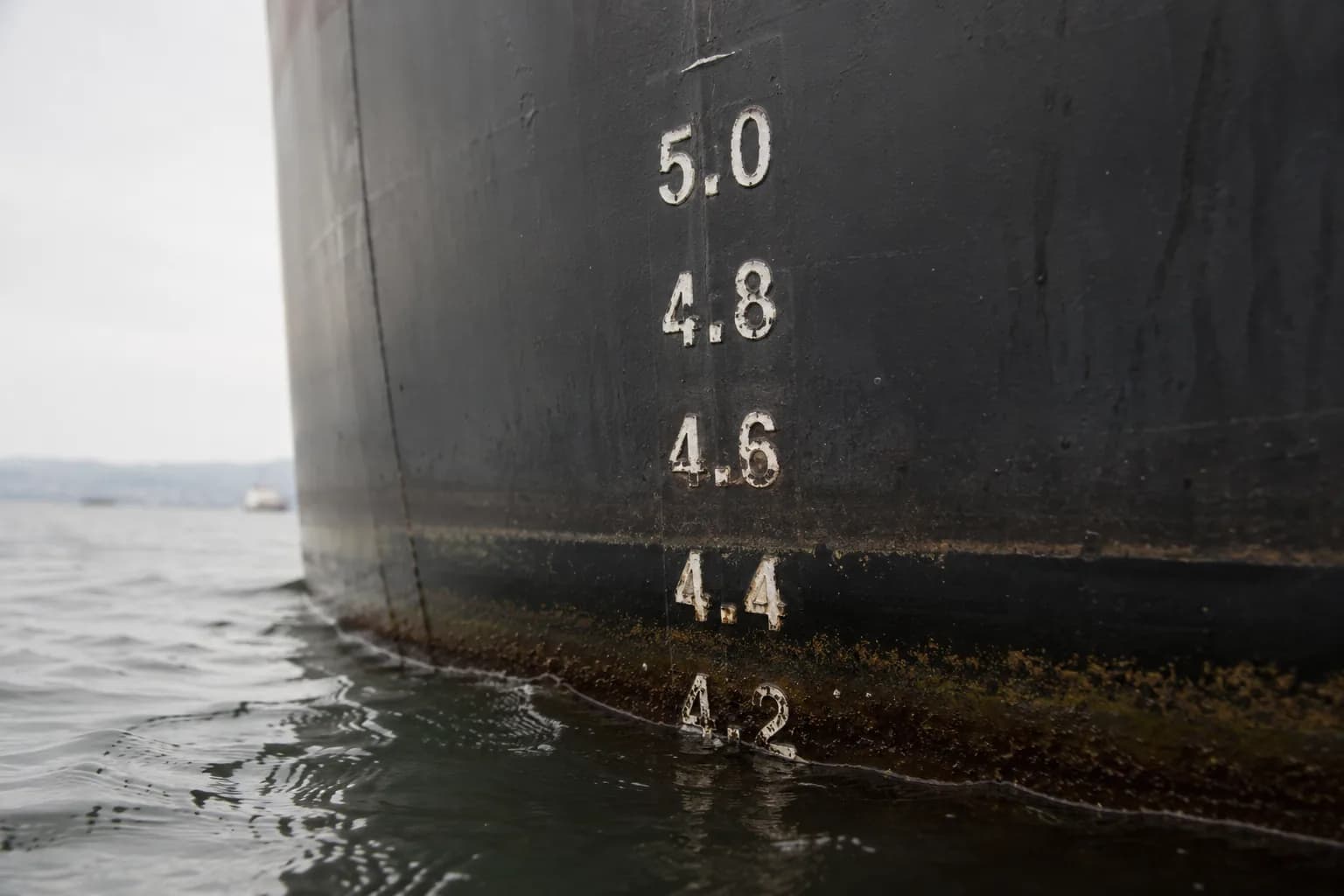 Draft marks on a ship's hull at the waterline